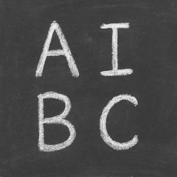 a school blackboard with the letters 'A', 'I', 'B' and 'C' written in chalk